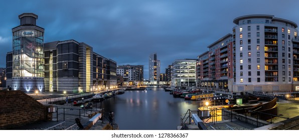 Leeds, UK - January 5h, 2019: View of Leeds Dock, (Clarence Dock) at dusk with buildings lit up. Also showing Royal Armories Museum