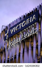 LEEDS, UNITED KINGDOM - Jan 04, 2020: Portrait Of John Lewis Carpark Signage During A Pink Sunset