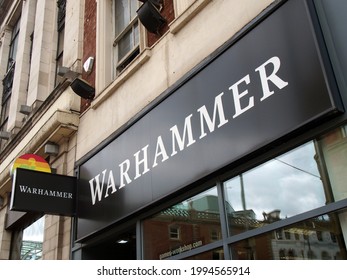 leeds, west yorkshire - 17 June 2021: sign and logo above a warhammer games store store on briggate in leeds city centre