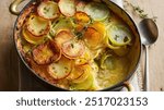 Leek and Potato Gratin: Creamy layers of thinly sliced potatoes and tender leeks, baked in a velvety garlic-infused cream sauce, topped with a golden Parmesan crust.