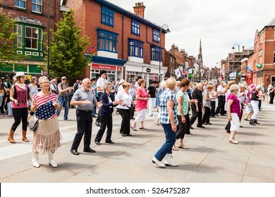 Leek, Staffordshire, England, U.K. June, 21 2014 : People Of All Ages Line Dancing In Leek Town, Staffordshire Moorlands, England