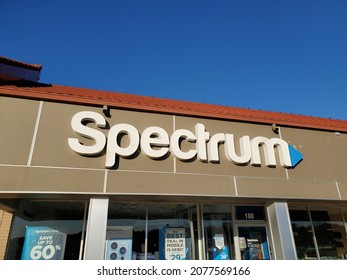 Lee's Summit Missouri USA - November 18 2021: Sign Above Building Entrance To Spectrum Retail Store Beneath Blue Sky