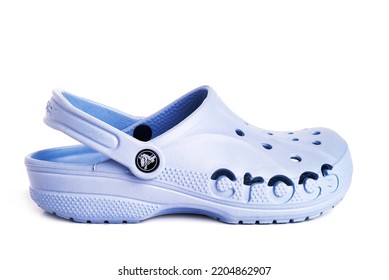 Leesburg. Virginia. USA. 21.09.2022.  Blue Crocs Footwear, Foam Clog Shoes On A White Background.