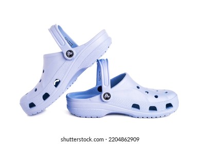 Leesburg. Virginia. USA. 21.09.2022.  Blue Crocs Footwear, Foam Clog Shoes On A White Background.