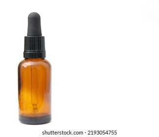 Left Aligned Eye Dropper Bottle On White Background With Copy Space. 