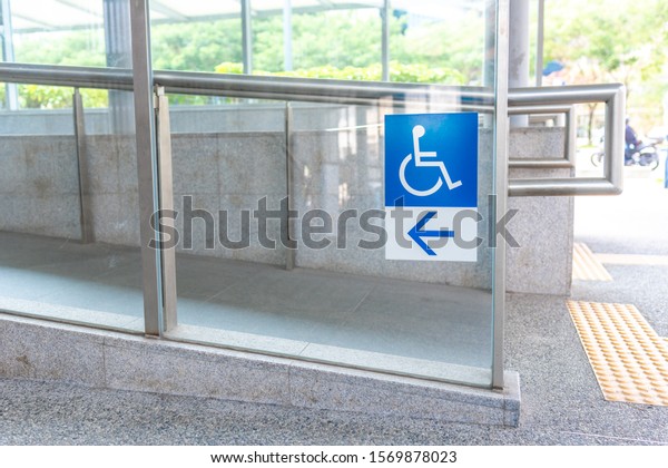 Left\
arrow pointing to ramp for wheelchair bounded\
people