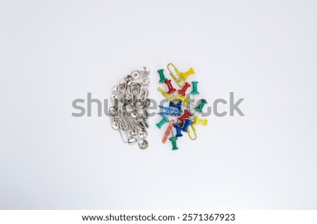 Left brain and right brain metaphor. Creative colors meet logical metal: a representation of the hemispheres of the brain with office supplies.