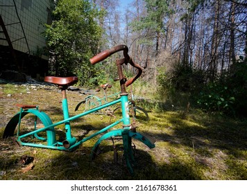 left children bicycle in Pripyat in Chernobyl Nuclear Power Plant Zone of Alienation                               