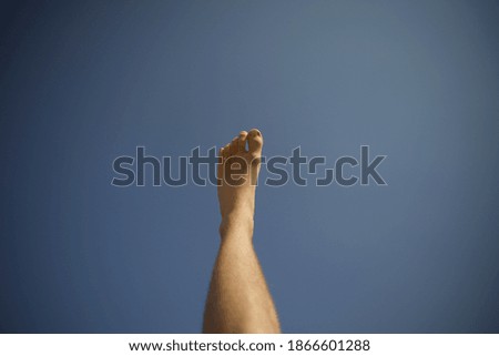 Similar – bare foot at the window