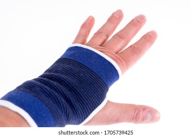 Left Hand With A Blue Bandage. Carpal Tunnel Syndrome Brace