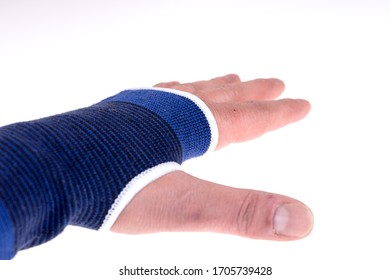 Left Hand With A Blue Bandage. Carpal Tunnel Syndrome Brace