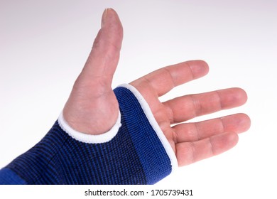 Left Hand With A Blue Bandage. Carpal Tunnel Syndrome Brace