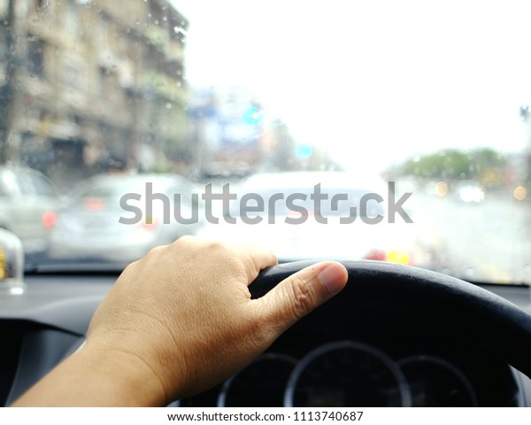 Left hand handle car steering wheel To\
steer Driving while in the rain and traffic\
slow.
