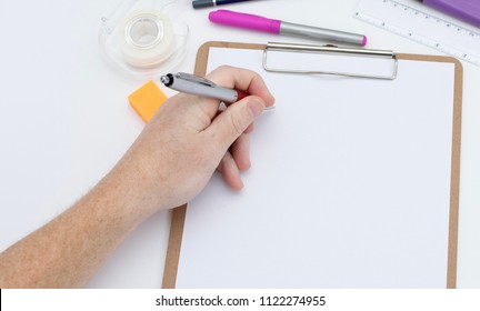 Left hand ready to write on the blank space