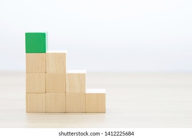 Left hand side Wooden cube Stacked in Triangle shape  without graphics for Business and design concept, Symbol of leadership, Teamwork and Growth. - Shutterstock ID 1412225684