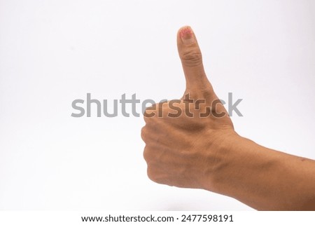 left hand thumbs up seen from the back of the hand isolated on white background.