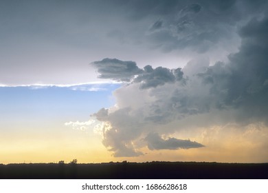 Left moving low precipitation supercell below the anvil of a much larger right moving supercell thunderstorm over the great plains in western Texas