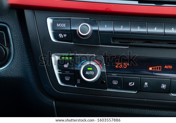 Left side, driver side, heated seats button and\
multimedia switch\
controls.