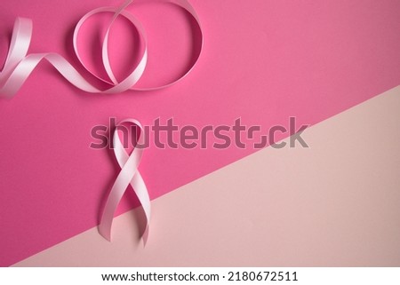 Left side photo with pink ribbon and pink background