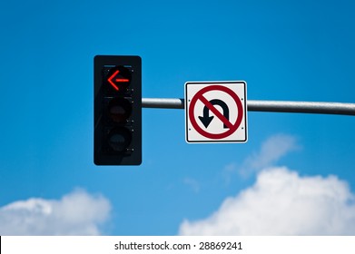 A Left Turn Lane Signal Light And No U-turn Sign.