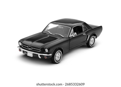 Left upper side view of a black muscle model toy car photographed on a white background