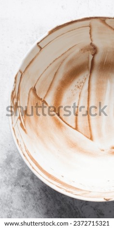 Leftover cake batter, Chocolate cake batter in a bowl that has been scraped clean, melted chocolate residue in a bowl