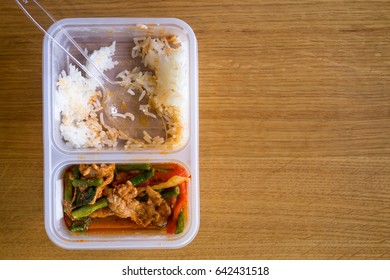 Leftover Thai Food Rice With Stir Fried Pork Belly And Red Curry Paste With Stringbean In A Plastic Box, On Top View.