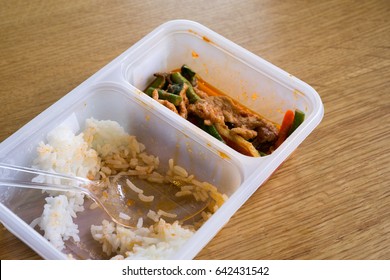 Leftover Thai Food Rice With Stir Fried Pork Belly And Red Curry Paste With Stringbean In A Plastic Box, On Top View.