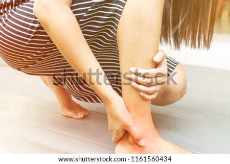 leg ankle injury/painful, women touch the pain ankle leg
