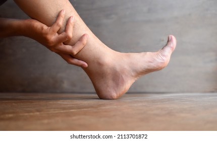 Leg of Asian young man. Concept of leg pain or problem. - Shutterstock ID 2113701872