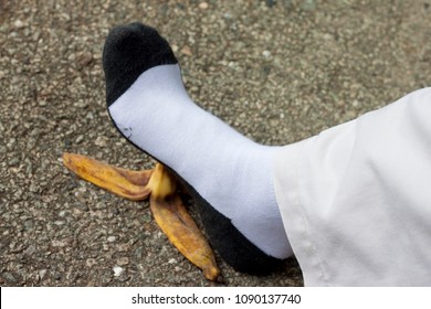 Leg Man Walk The Pedal Banana Fruit On Cement Floor Because Socks May Be Slippery.