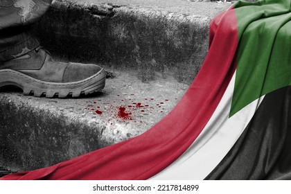 The leg of the military stands on the step next to the flag of Sudan, the concept of military conflict