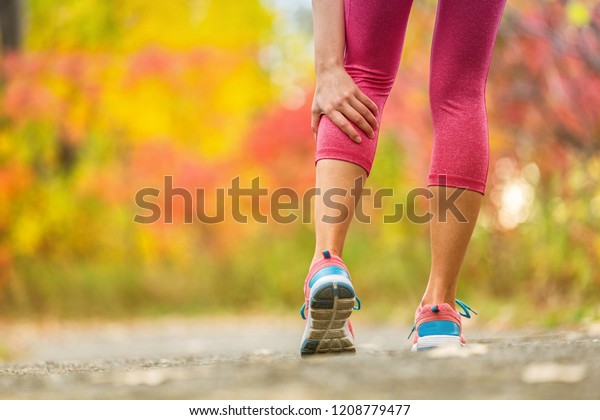 Leg\
muscle cramp calf sport injury outdoors\
exercise.