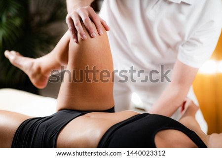 Leg Osteopathy treatment. Chiropractor with patient