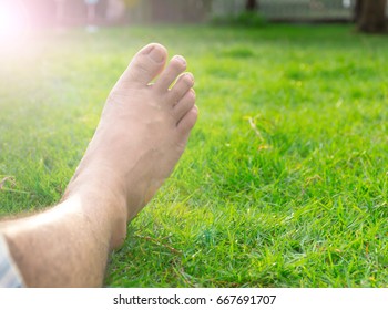 Leg right  man lying in the lawn