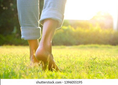Leg of woman is on  to walk down the grass to exercise in the morning. Health and Relaxation Concepts - Shutterstock ID 1396055195