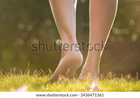 Leg of woman is on  to walk down the grass to exercise in the morning. Health and Relaxation Concepts