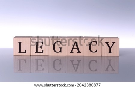 LEGACY concept, wooden word block on grey background