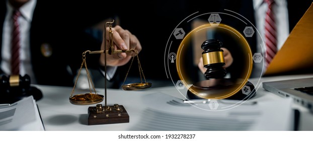 Legal Advice Concept. Lawyer Hands Working At Table Office With Law Virtual Interface Screen, Blurred Background.