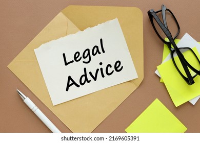 Legal Advice word written on a white page on an envelope