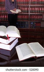 Legal Books On Table - South African Law Reports, Intern Doing Research