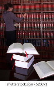 Legal Books On Table - South African Law Reports - Intern Doing Research