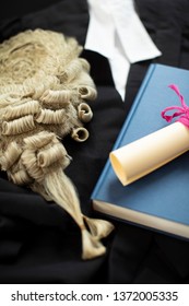 Legal Concept Still Life Of Barristers Wig With Gown And Brief