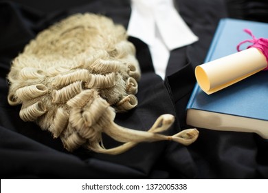 Legal Concept Still Life Of Barristers Wig With Gown And Brief