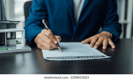 Legal consultant and real estate attorney lawyer read the building lease contract signing agreement for local business. - Shutterstock ID 2298415023