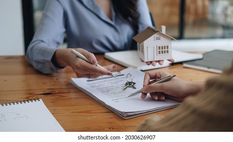 Legal Consultants, Notary Or Justice Lawyer Discussing Contract Document On Desk With Client Customer In Courtroom Office, Business, Justice Law, Insurance, Legal Service, Buy And Sell House Concept