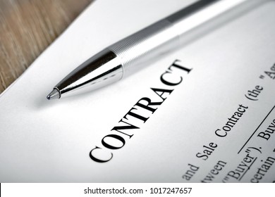 Legal contract signing - buy sell real estate contract - Shutterstock ID 1017247657
