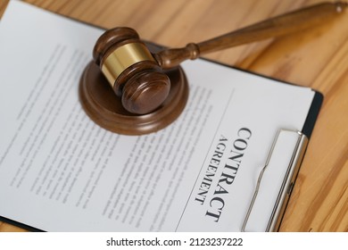 Legal Contracts Are Subject To Commercial Disputes Resolved In The Courts Of Justice, Contract With Gavel.