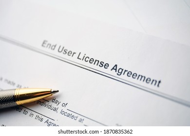 Legal Document End User License Agreement On Paper Close Up.