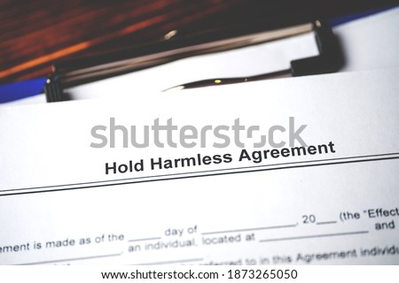 Legal document Hold Harmless Agreement on paper close up.